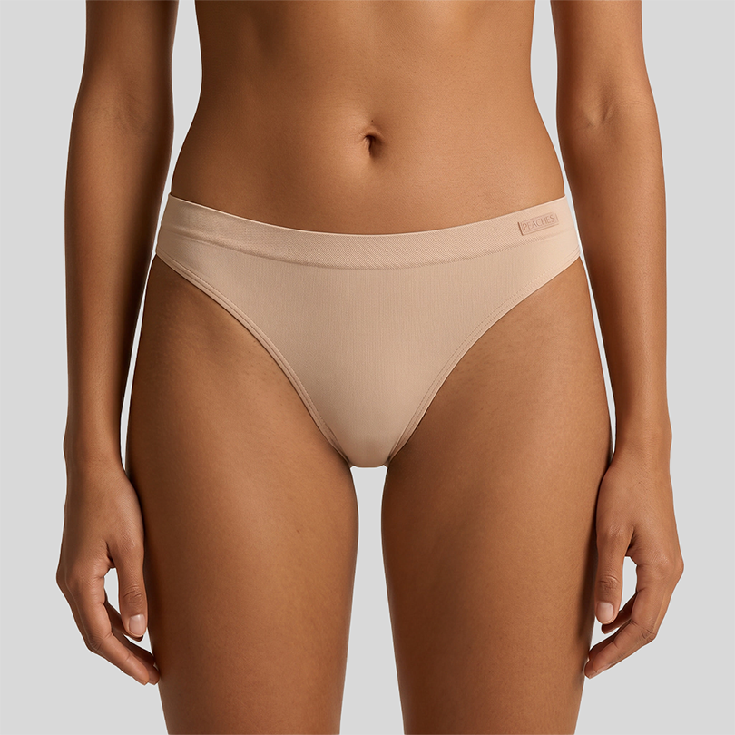 Peaches The Secret Trio Pack — seamless thong underwear worn by model, front view