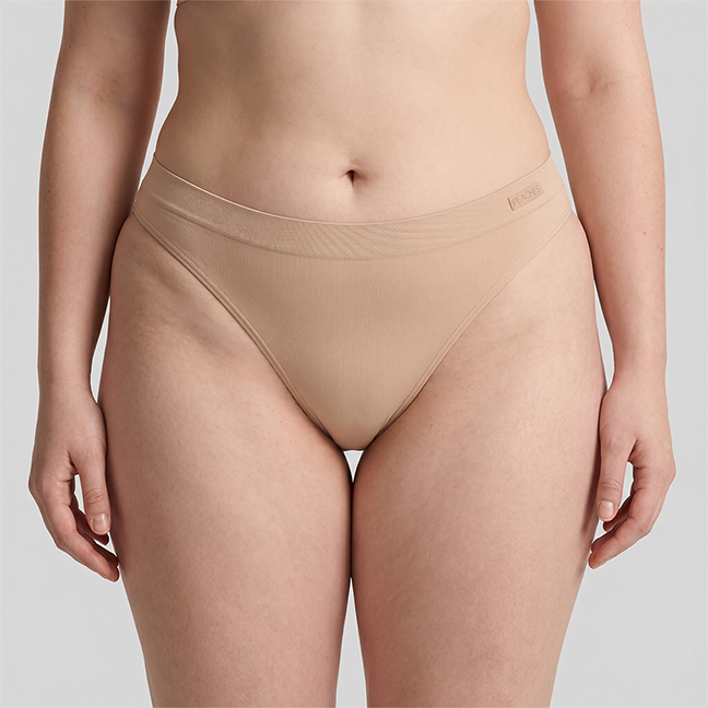 Peaches thong in beige, front view on model